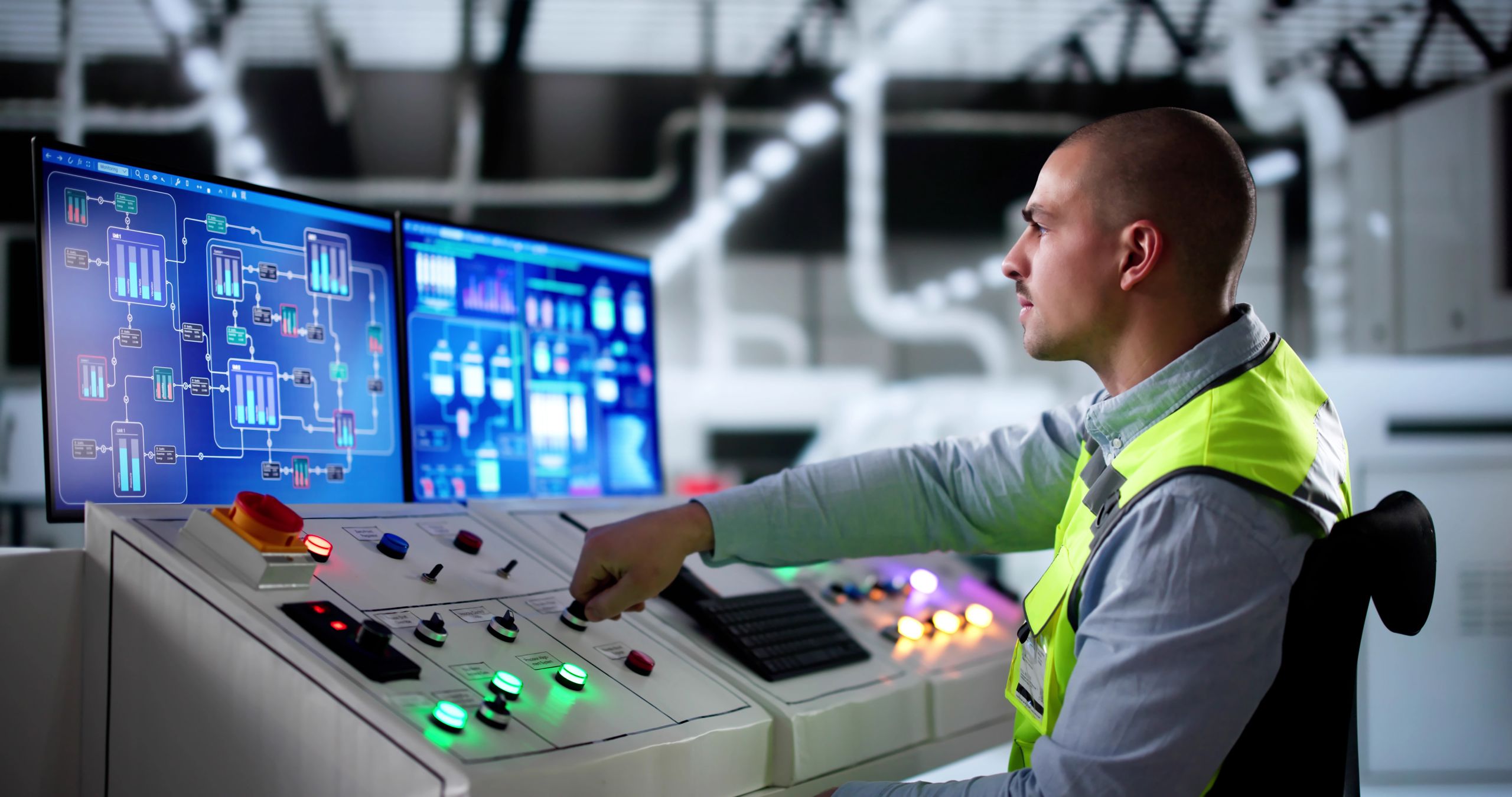 Man is working on a Scada system. 