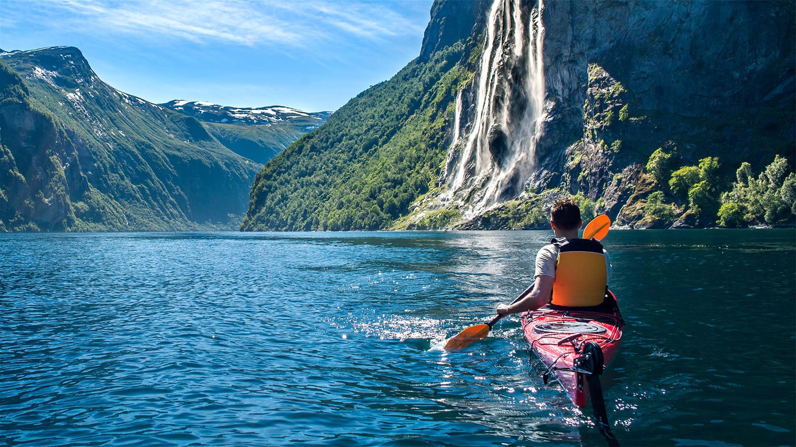 Man paddling a kayak in beautiful nature