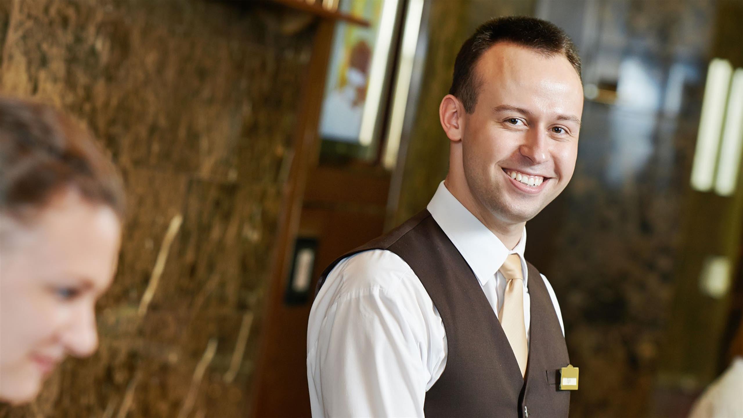 Smiling man at the reception desk